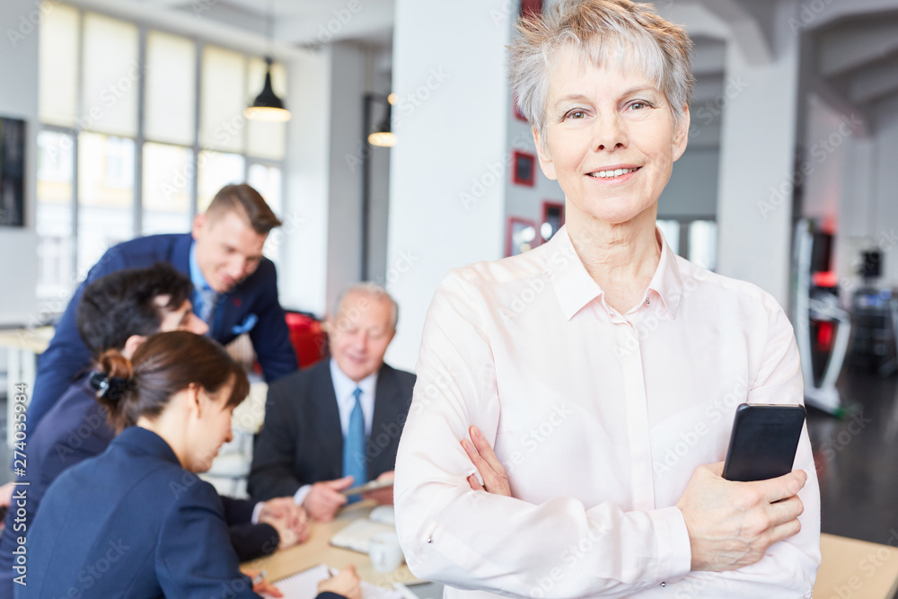 Senior businesswoman standing self confident Senior businesswoman standing self confident