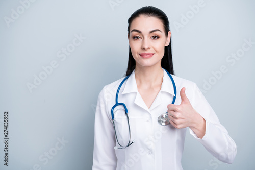 Close up photo beautiful she her lady doctor hospital cardiologist agree best service thumb raised up expert tested recommending wear phonendoscope white science robe costume isolated grey background