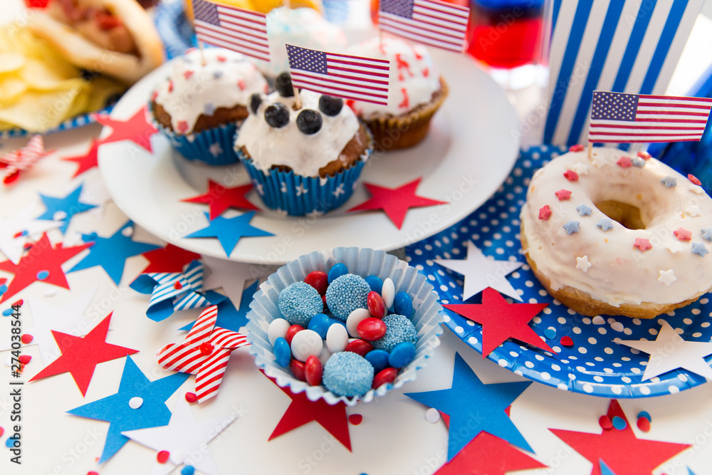 celebration and national holidays concept - food and drinks decorated for american independence day party at home celebration and national holidays concept - food and drinks decorated for american independence day party at home