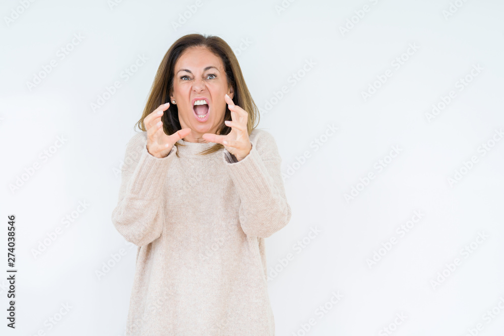 Beautiful middle age woman over isolated background Shouting frustrated with rage, hands trying to strangle, yelling mad Beautiful middle age woman over isolated background Shouting frustrated with rage, hands trying to strangle, yelling mad
