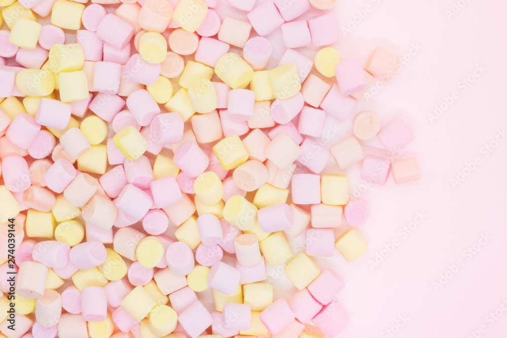 Marmellow air marshmallow close-up on a pink background, pastel colors, light dessert, place for text Marmellow air marshmallow close-up on a pink background, pastel colors, light dessert, place for text