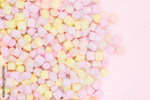 Marmellow air marshmallow close-up on a pink background, pastel colors, light dessert, place for text