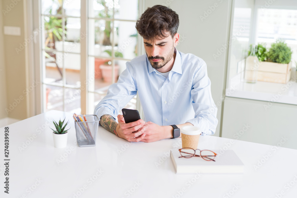 Young business man working using smartphone