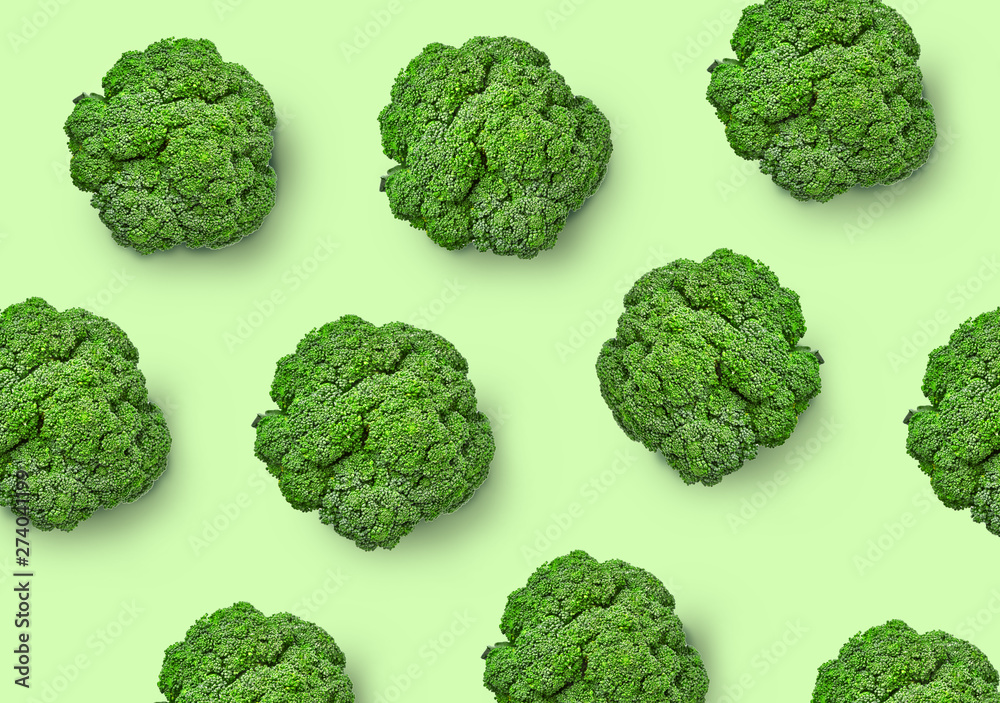 Broccoli cabbage on a colored background. Pattern of fresh broccoli cabbage. Top view of broccoli. Isolated