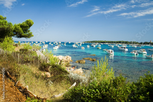 anchored boats in the channel between Saint Honorat and Ile Marguerite photo