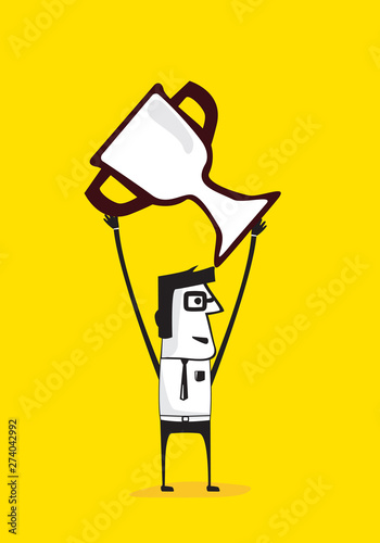 Businessman holding up a trophy