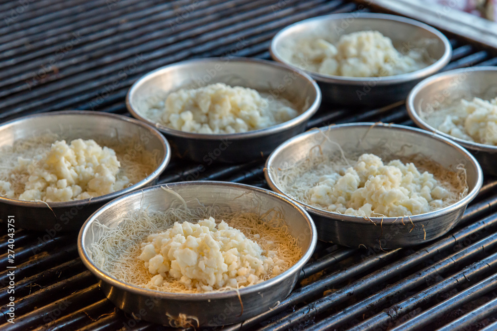 Preparing personal knafeh in a tray Preparing personal knafeh in a tray