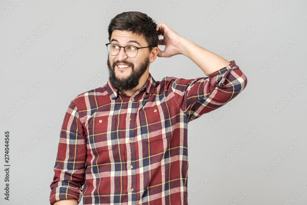 Portrait of focused smart male model with with thoughtful determined expression Portrait of focused smart male model with with thoughtful determined expression