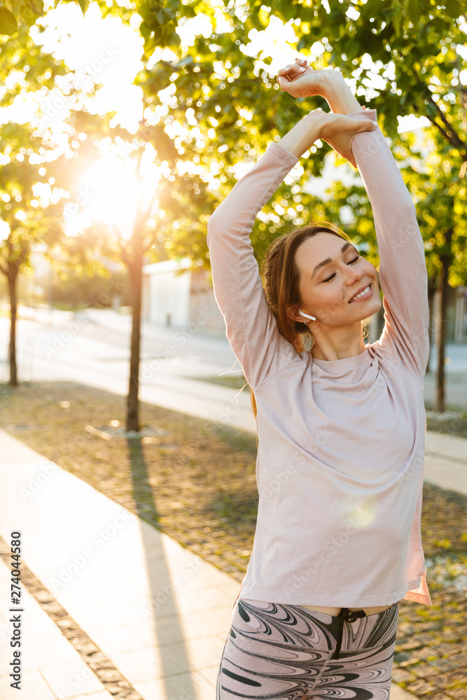 Attractive young fitness woman wearing sports clothing Attractive young fitness woman wearing sports clothing