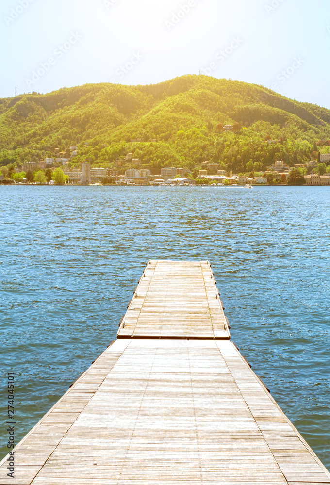 Obraz premium Pier on the beautiful summer Como lake in Italy.