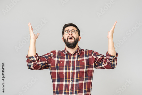 Tableau sur toile Confused  man asking from Heaven raising his hand