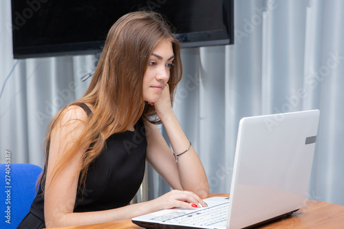 Happy Young Beautiful Woman Using Laptop  Indoors