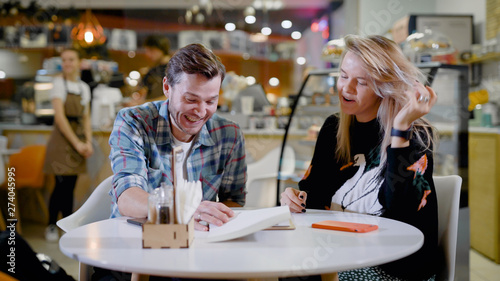 Handsome young man and attractive young woman are spending time together.