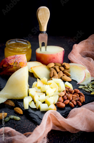 Assorted cheeses in various shapes and sizes photo