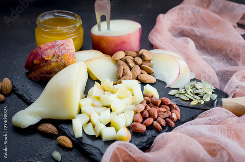 Assorted cheeses in various shapes and sizes photo