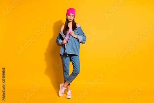 Full length body size photo beautiful pretty nice she her teenager lady self-confident ready chill party amazing lovely look wear casual jeans denim jacket shoes pink hat isolated yellow background
