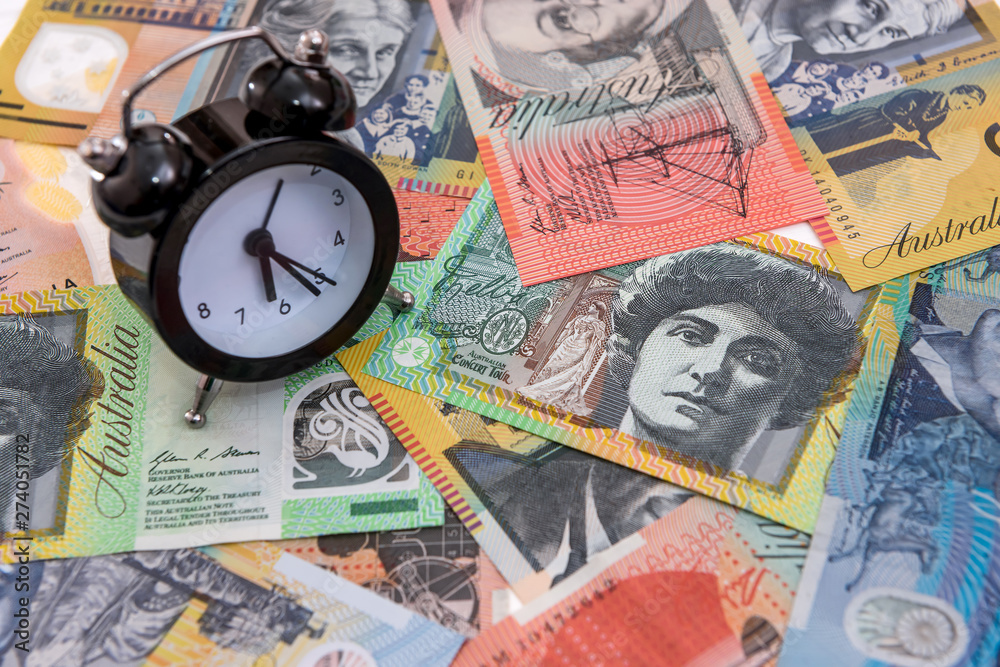 Fototapeta premium Clock with alarm at australian dollars close up