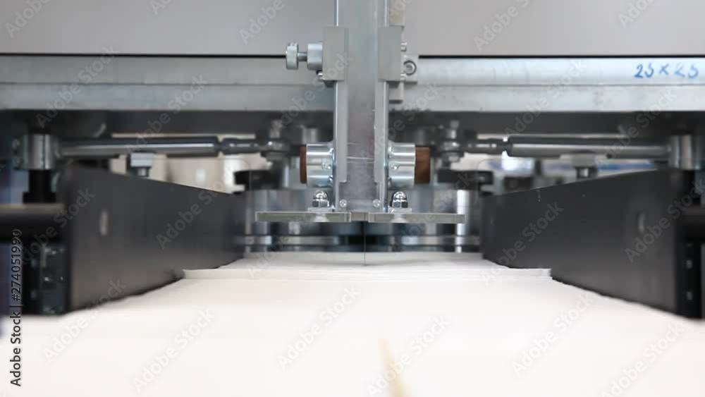 Production of white napkins in factory, close up Production of white napkins in factory, close up