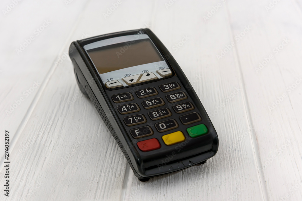Banking terminal on wooden background close up Banking terminal on wooden background close up