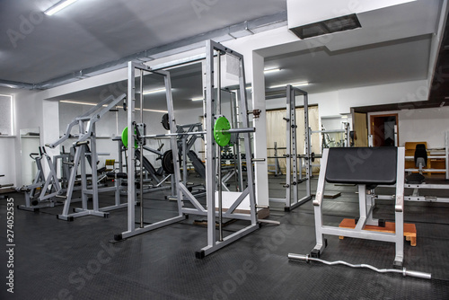 Different sport equipment in modern gym closeup