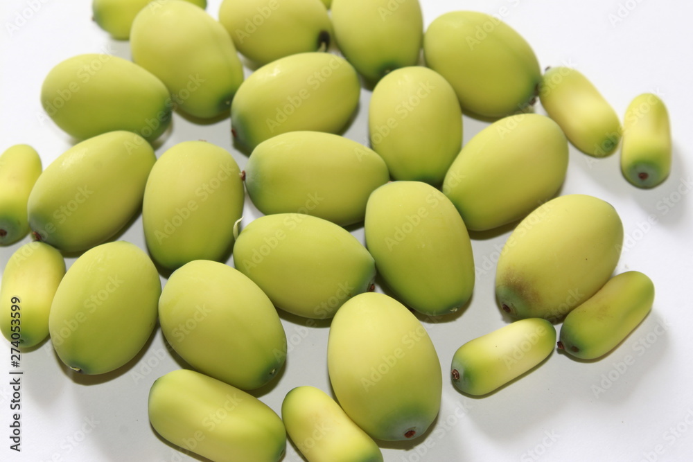 Lotus (Nelumbo nucifera) seeds against white background.Also known as sacred lotus, bean of India, Egyptian bean Lotus (Nelumbo nucifera) seeds against white background.Also known as sacred lotus, bean of India, Egyptian bean