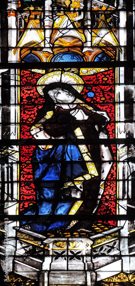 Virgin Mary under the Cross, stained glass window in Saint Severin church in Paris, France