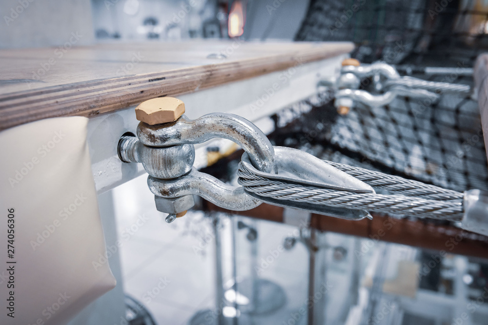 fastening of a steel cable to a metal construction close up