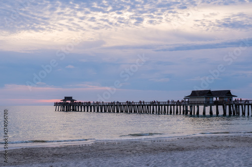 Naples pier in a purple and pink haze, shot at sunset, Florida, USA