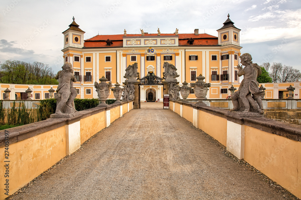 MILOTICE, CZECH REPUBLIC - April 23rd, 2018: Entrance to the old castle with two rows of sculptures, historic background