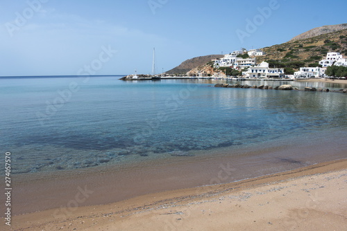 Fototapeta Naklejka Na Ścianę i Meble -  Greece, the quiet island of Sikinos in the Cyclades chain. The harbor beach.  A spring day before the summer crowds.  The weather is perfect and the beach is your own.