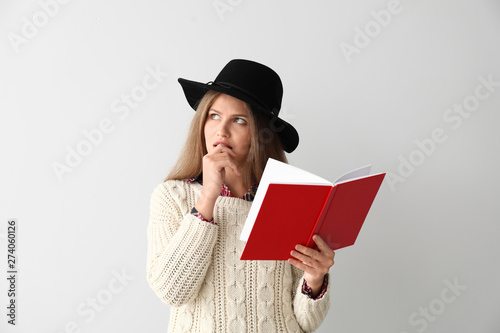 Thoughtful young woman with...