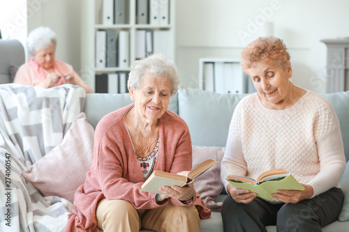Senior women reading books ...