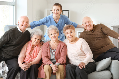 Young caregiver with group ...