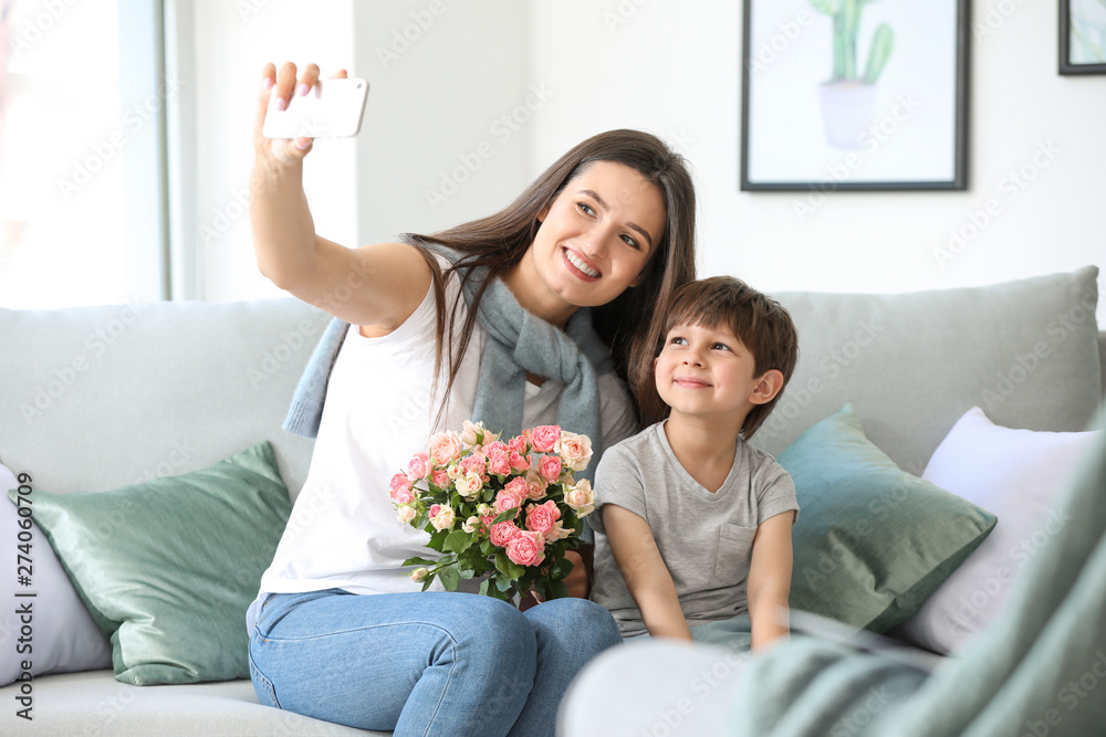 Happy mother and son taking selfie at home Happy mother and son taking selfie at home