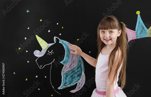 Cute little girl near dark ...