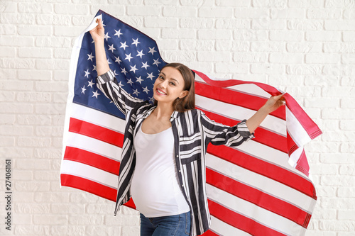 Happy pregnant woman with n...