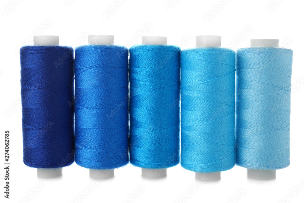 Colorful sewing threads on white background Colorful sewing threads on white background