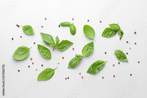 Fresh green basil and pepper on white background