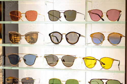 Many beautiful and colorful sunglasses displaying in store