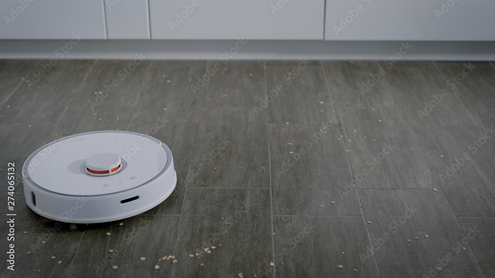 round modern robotic vacuum cleaner is 