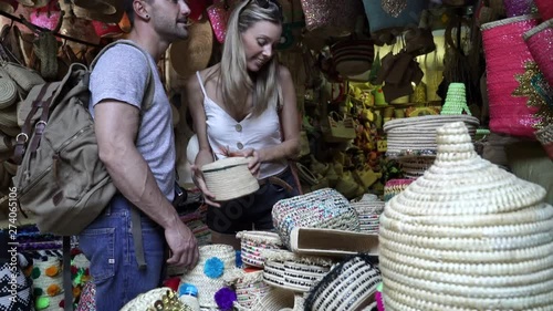Couple of tourists in Moroccan souk, Marrakech medina