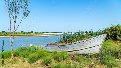 Fishing boat by the river bank