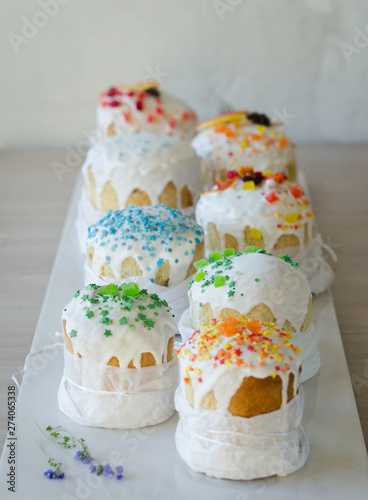Happy Easter, traditional Russian easter cake Kulich on a white background, decorated with color decorations