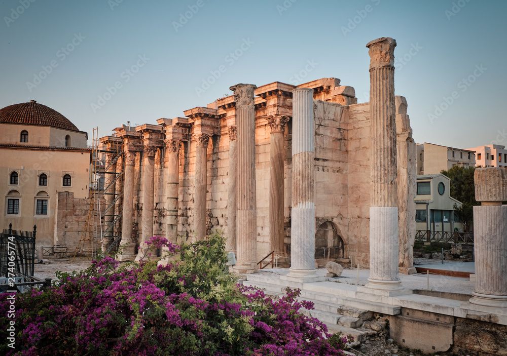 Fototapeta premium temple and columns in the ancient area of Monastiraki near Acropolis at sunset in the capital Greece - Athens.