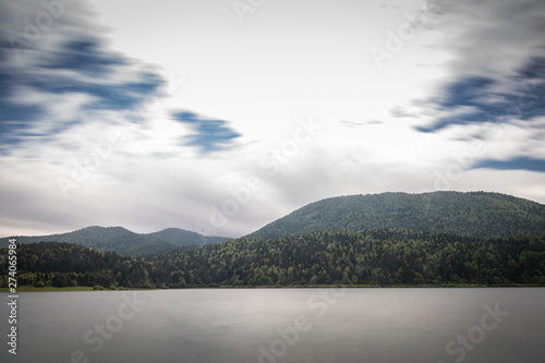 scenic view on beautiful intermittent lake cerknica, with water in long exposure, spring season, slovenia