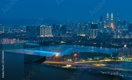 Open roof top balcony with cityscapes night view . © jamesteohart