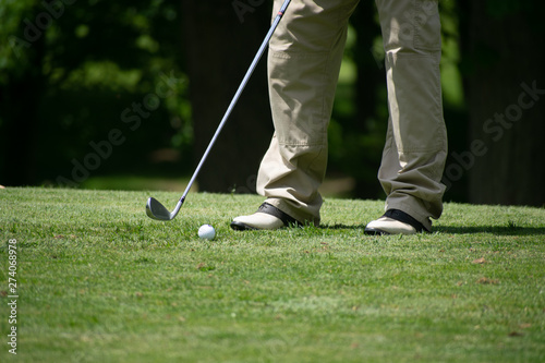 golfer putting on green