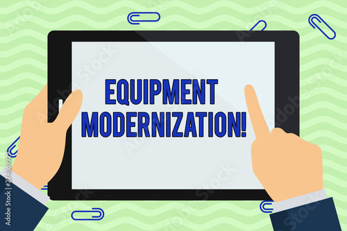 Writing note showing Equipment Modernization. Business photo showcasing changing product service to include new functions Hand Holding Pointing Touching Color Tablet White Screen.