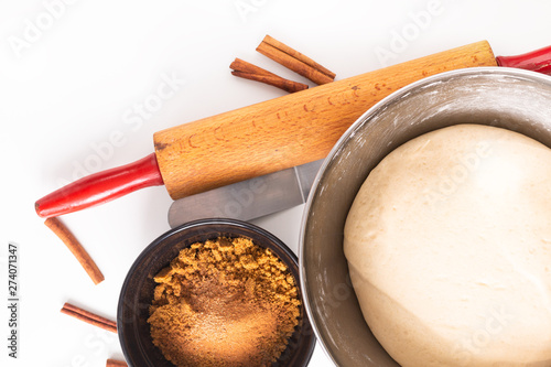 Food baking concept bakery preparation proofed bread dough for bread or cinnamon rolls on white background