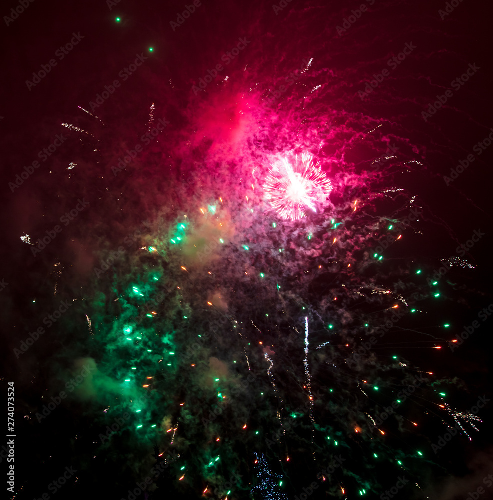 Beautiful sparks from fireworks in the sky at night